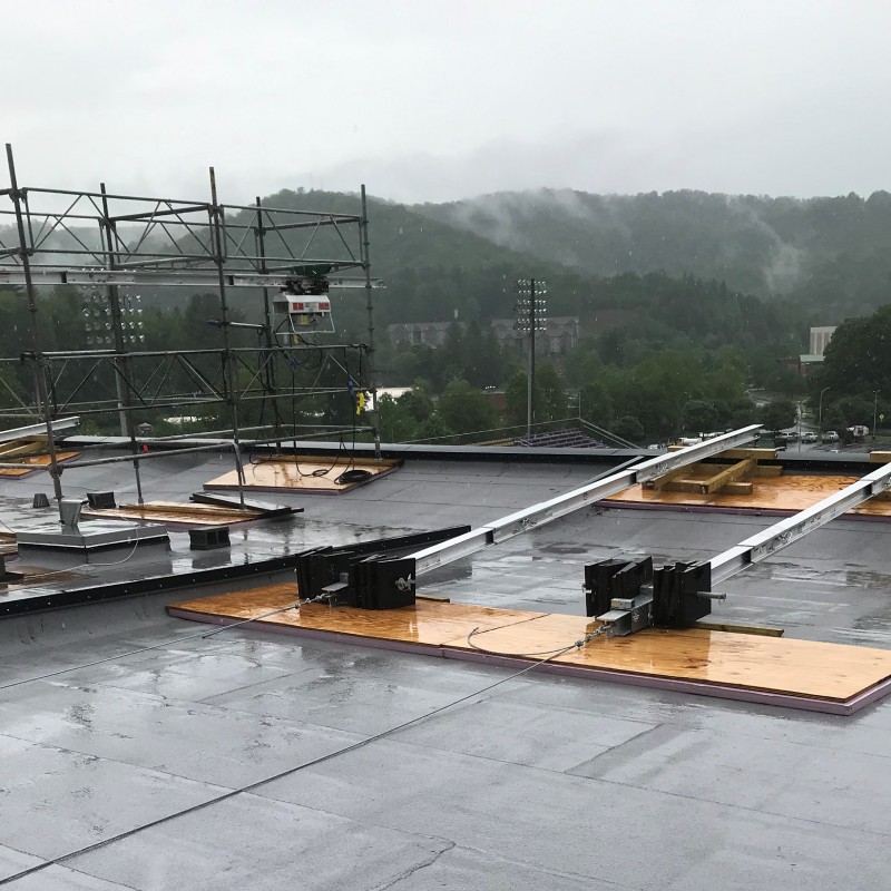 Suspended scaffolding on top of a college stadium